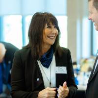 President Philomena V. Mantella mingling with a guest at the Foundation Annual Meeting